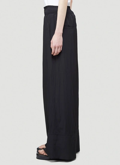 Shop Jw Anderson Wide Leg Pants In Black