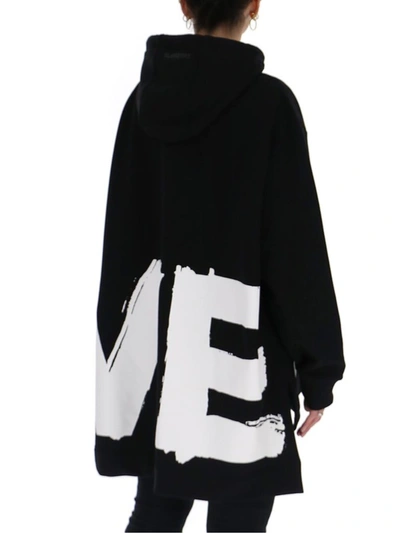 Shop Burberry Love Print Oversized Hoodie In Black