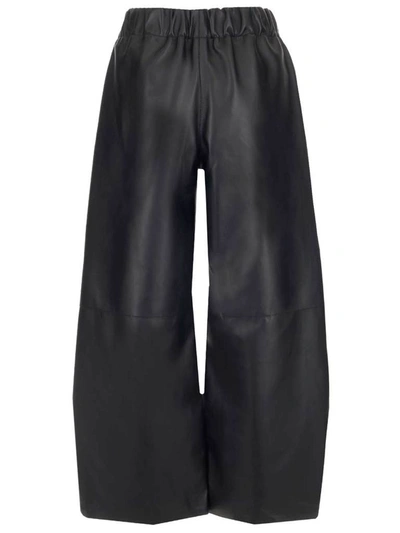 Shop Loewe Cropped Leather Trousers In Black