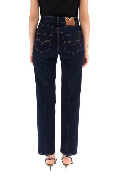 Shop Valentino Logo Patch Bootcut Jeans In Blue