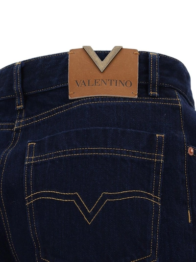 Shop Valentino Logo Patch Bootcut Jeans In Blue