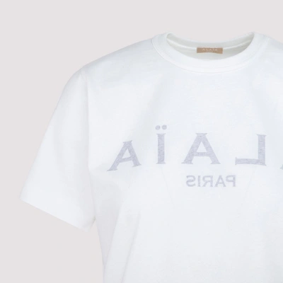 Shop Alaïa Alaia Logo Print Jersey T In White