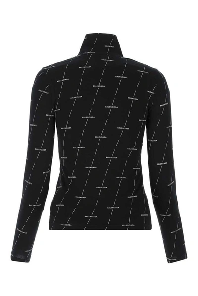 Shop Balenciaga Allover Logo Turtleneck Top In Black