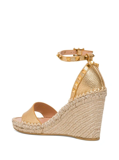 Shop Valentino Garavani Rockstud Double Wedge Sandals In Gold