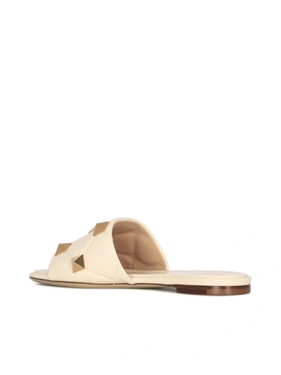 Shop Valentino Garavani Roman Stud Slides In White