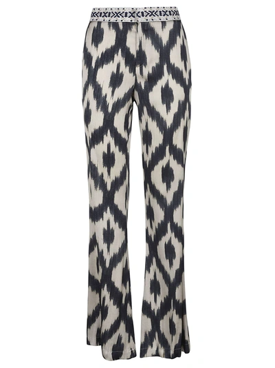Shop Bazar Deluxe All-over Patterned Trousers In Beige