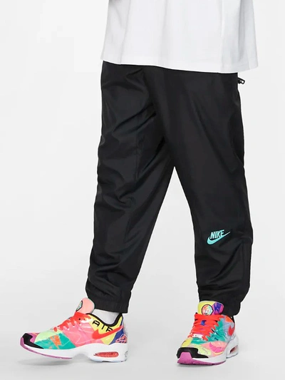 Shop Nike Track Pants In Black