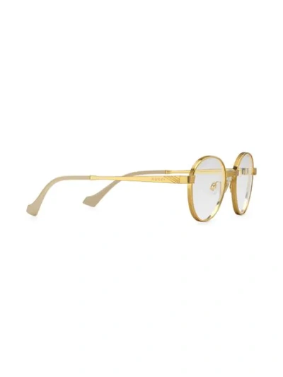 Shop Gucci Round Frame Sunglasses In Gold