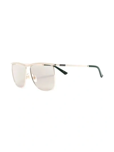 Shop Gucci Lightly Tinted Oversized Sunglasses In Gold