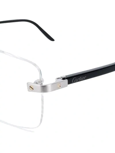 Shop Cartier Thin Frame Glasses In Black