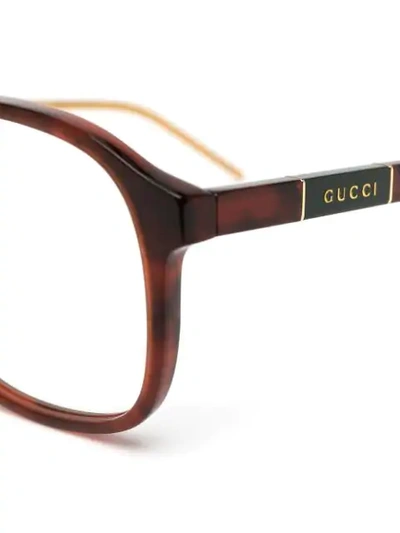 Shop Gucci Round Frame Tortoiseshell Glasses In Brown