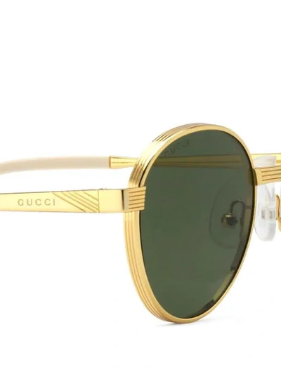 Shop Gucci Round-frame Sunglasses In Gold