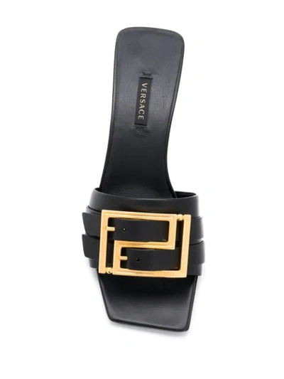 Shop Versace Slip-on Buckle Sandal In Black