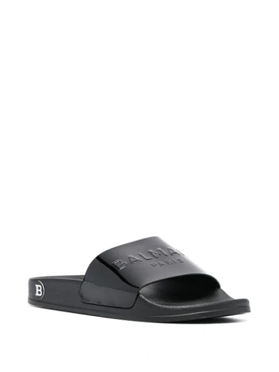 Shop Balmain Embossed Logo Slide Sandals In 0pa Black