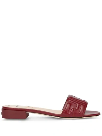 Shop Fendi Embossed Logo Low Heel Slide Sandals In Brown