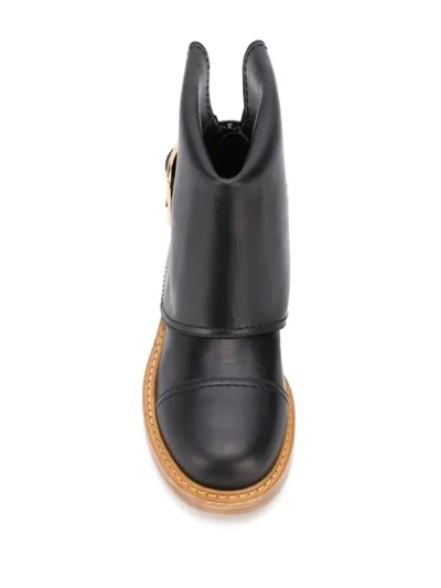 Shop Alexander Mcqueen Buckle-detail Ankle Boots In Black