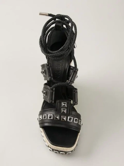 Shop Alexander Mcqueen Studded Wedge Sandals In Black