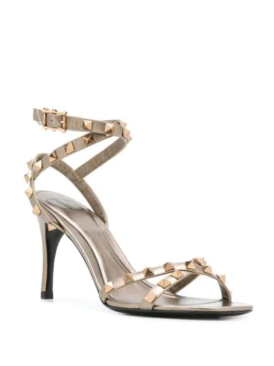 Shop Valentino Rockstud 85mm Sandals In Gold