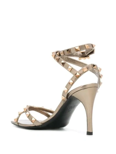 Shop Valentino Rockstud 85mm Sandals In Gold