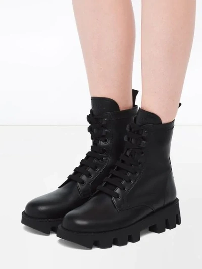Shop Prada Calf Leather Laced Booties In Black