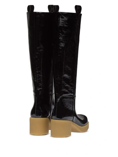 Shop Miu Miu Pull-tab Knee-high Boots In Black