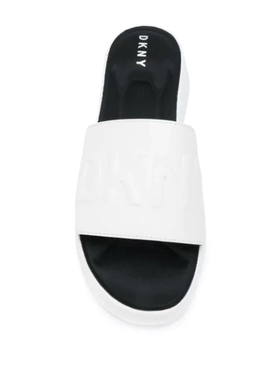 Shop Dkny Mara Embossed Logo Wedge Slides In White
