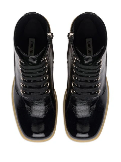 Shop Miu Miu Military-style Ankle Boots In Black