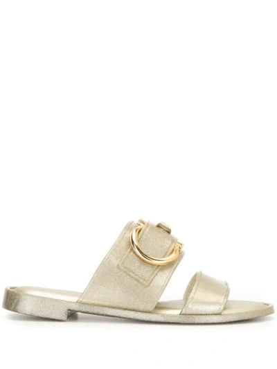 Ferragamo Taryn Buckled Metallic Rubber Slides In Gold