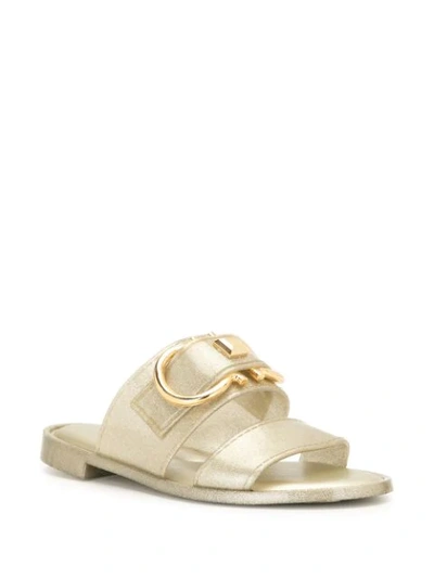 Ferragamo Taryn Buckled Metallic Rubber Slides In Gold