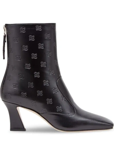 Shop Fendi Logo-embossed Ankle Boots In Black