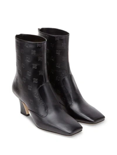 Shop Fendi Logo-embossed Ankle Boots In Black