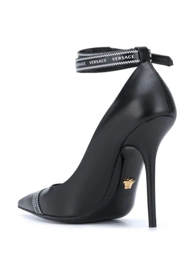 Shop Versace Logo-band Pointed Pumps In Black