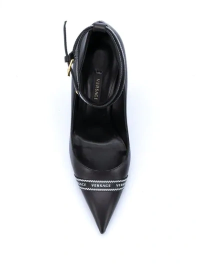 Shop Versace Logo-band Pointed Pumps In Black