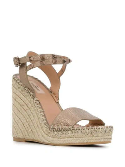 Shop Valentino Rockstud Espadrille Wedge Sandals In Gold