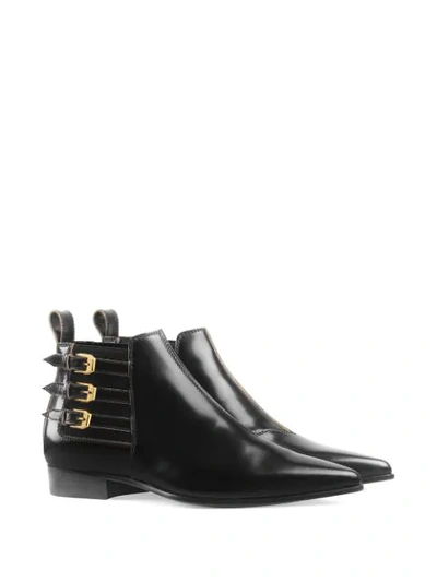 Shop Gucci Buckled Ankle Boots In Black
