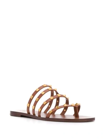 Shop Valentino Rockstud Slip-on Sandals In Brown