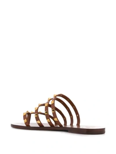 Shop Valentino Rockstud Slip-on Sandals In Brown