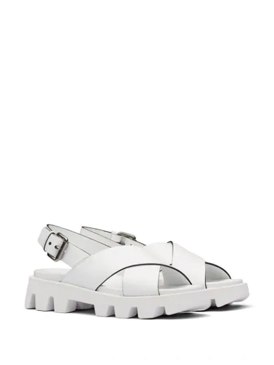 Shop Prada Crossover Strap Sandals In White