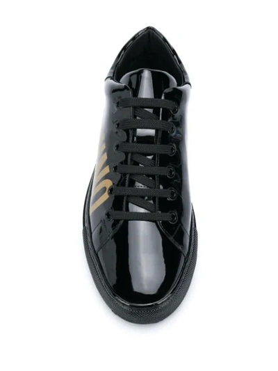 Shop Moschino Logo Print Sneakers In Black