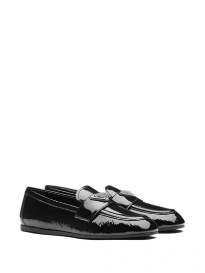 Shop Prada Naplak Leather Loafers In Black