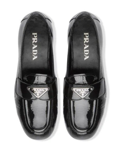 Shop Prada Naplak Leather Loafers In Black