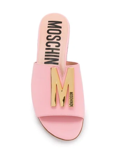 Shop Moschino M Plaque Sandals In Pink