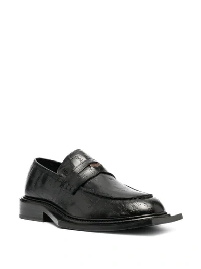 Shop Martine Rose Volcano Debossed Text Loafers In Black