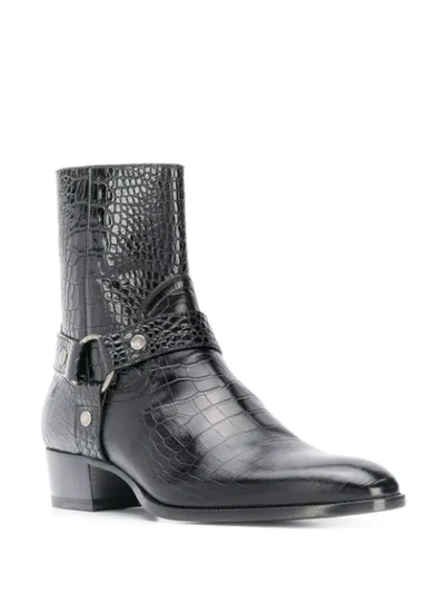 Shop Saint Laurent Wyatt Harness Boots In Black