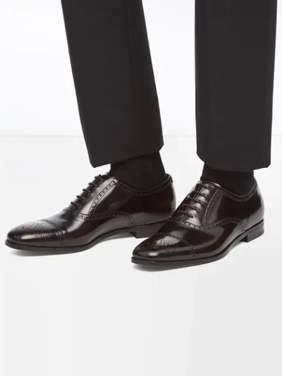 Shop Prada Brogue Motif Oxford Shoes In Brown