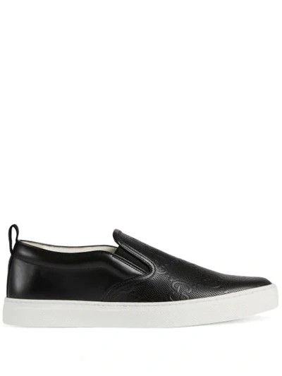 Shop Gucci Gg-embossed Slip-on Sneakers In Black