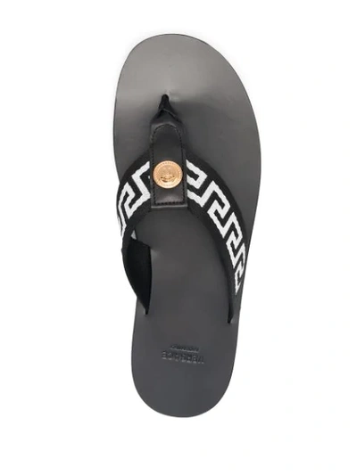 Shop Versace Greca-motif Thong-strap Flip-flops In Black