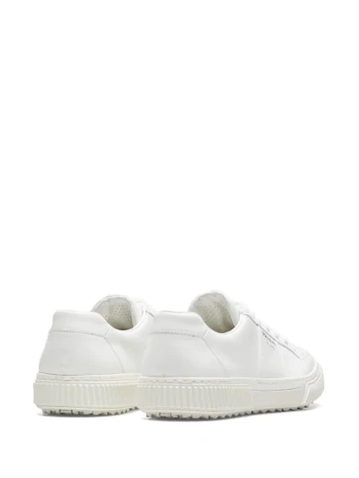 Shop Prada Logo-embossed Lace-up Sneakers In White