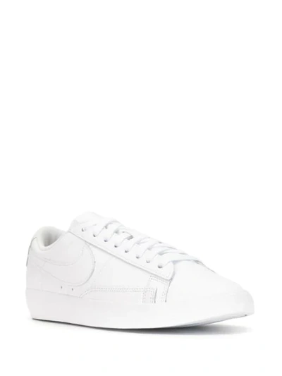 Shop Nike Blazer Low Lace-up Sneakers In White