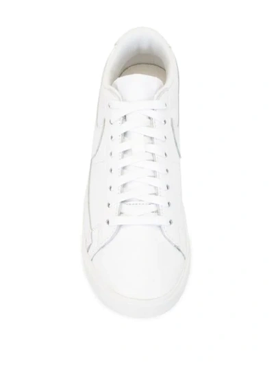 Shop Nike Blazer Low Lace-up Sneakers In White